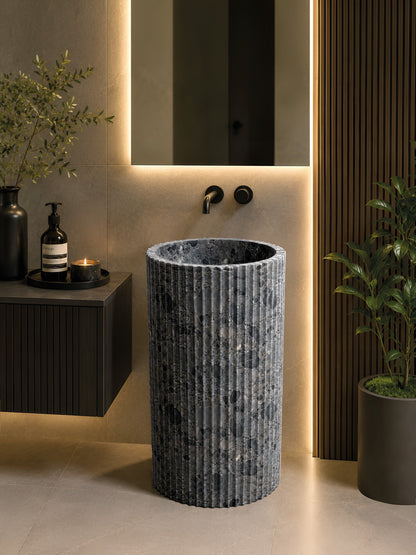 Trento natural stone basin in a bathroom setting