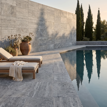 Silver Travertine paving beside a serene pool courtyard