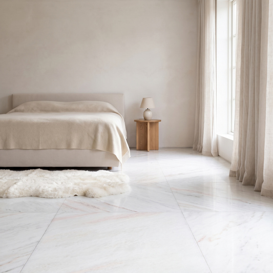 Bianco Rosa marble floor in a light-filled bedroom