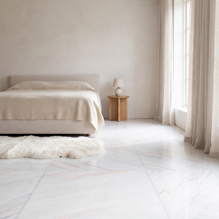 Bianco Rosa marble floor in a light-filled bedroom