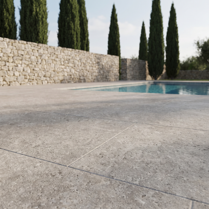 Pewter Travertine porcelain paving in an outdoor setting