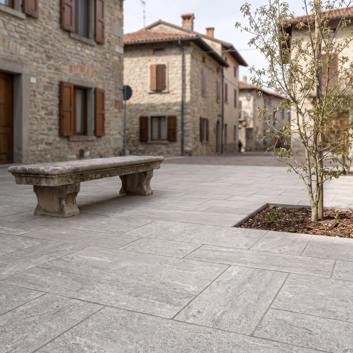Cobble Modular Quartz Gray porcelain paving in an outdoor setting