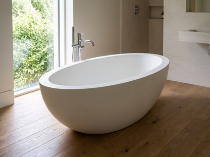Ancona natural stone solid bathtub in a bathroom setting