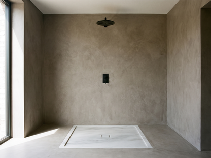Ortigia solid stone shower tray in a walk-in shower
